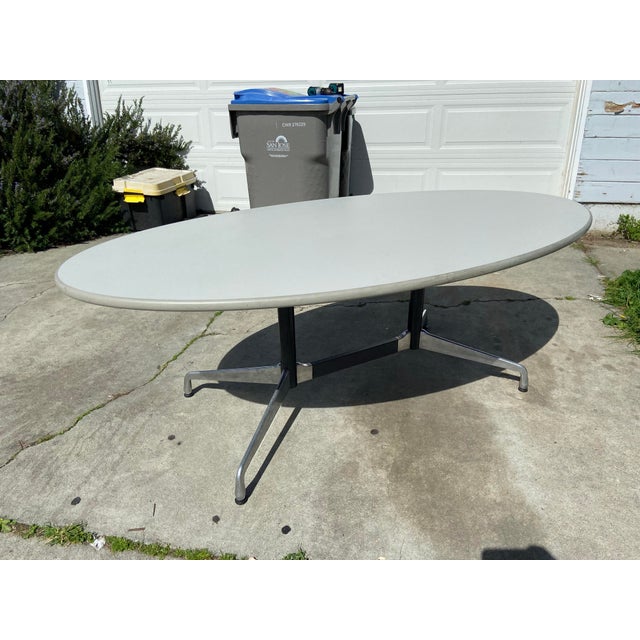 This Vintage Herman Miller Aluminum Segmented Base Oval Steelcase Top conference table is a stunning piece of mid-century...