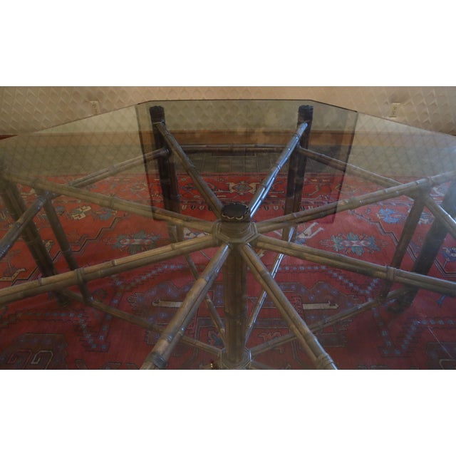 Gorgeous vintage McGuire octagonal dining table. Bamboo base structure with large glass top surface. Glass top is...