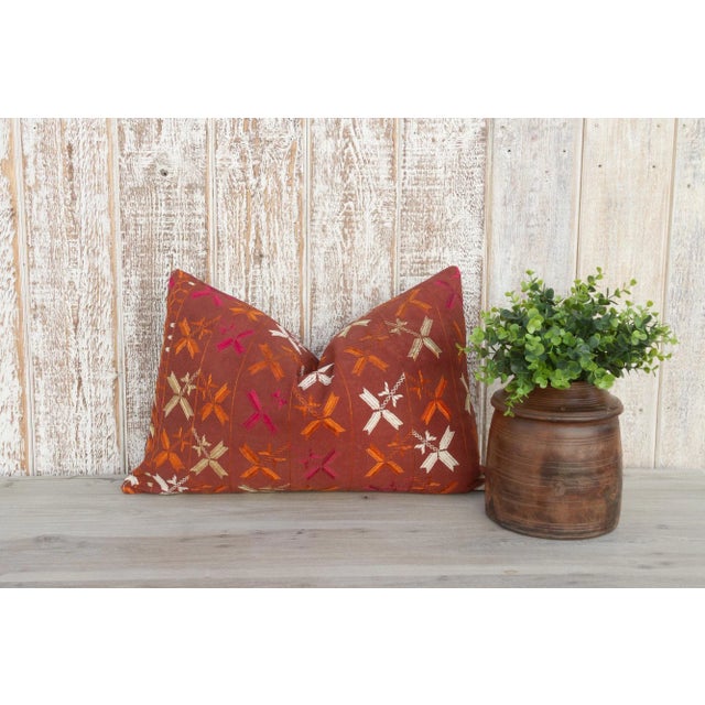 This colorful and luxurious Bagh Phulkari pillow features beautiful hand-done silk embroidery on top of a cotton fabric....