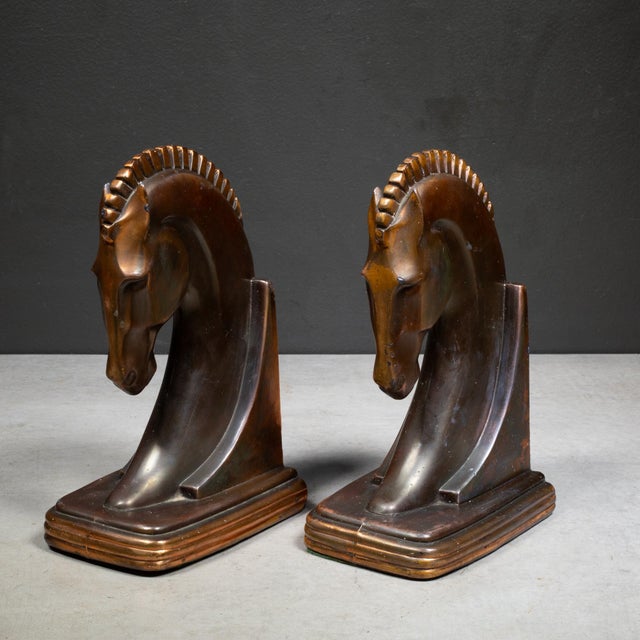 ABOUT Art Deco Trojan horse bookends with original sticker manufactured by Dodge Trophy Inc. Bronze and copper finish with...