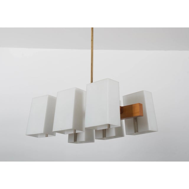 - Brass construction with twelve arms - Cone shaped shades each fitted with E14 sockets - Made in Vienna by Rupert Nikoll...