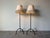 Striking pair of 1980s vintage metal tripod floor lamps featuring a clean, architectural silhouette. Each lamp is crafted...