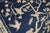 A late 19th century Chinese rug featuring 3 monkeys and some birds on a landscape scene. Navy field, beige accent colors....