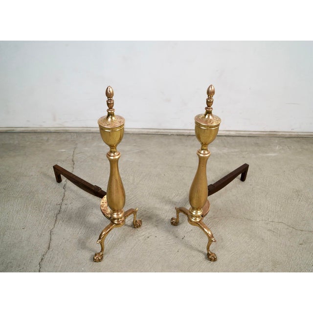 Pair of antique 1930's andirons for sale. These were manufactured by Bennett, and have the brand engraved in the iron....