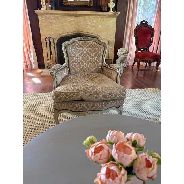 Louis XVI style Bergere chairs with distressed cream painted and carved frames. Raised velvet design in pink ,cream and...