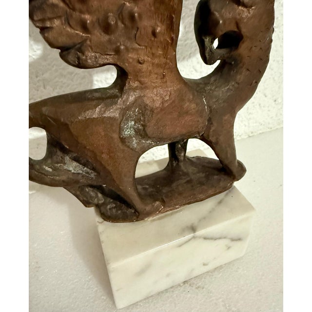 Milton Hebald (American, 1917-2015) Lion of Judah menorah bronze on a white marble plinth base signed in bronze 12" H x...