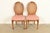 A gorgeous pair of French Regency Louis XVI style side chairs or dining chairs By Drexel USA, Circa 1960s Carved solid...