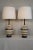 A Pair of Mid Century Modern Table lamps. Embossed ceramic gives each piece texture and depth. Walnut fittings,and wood...