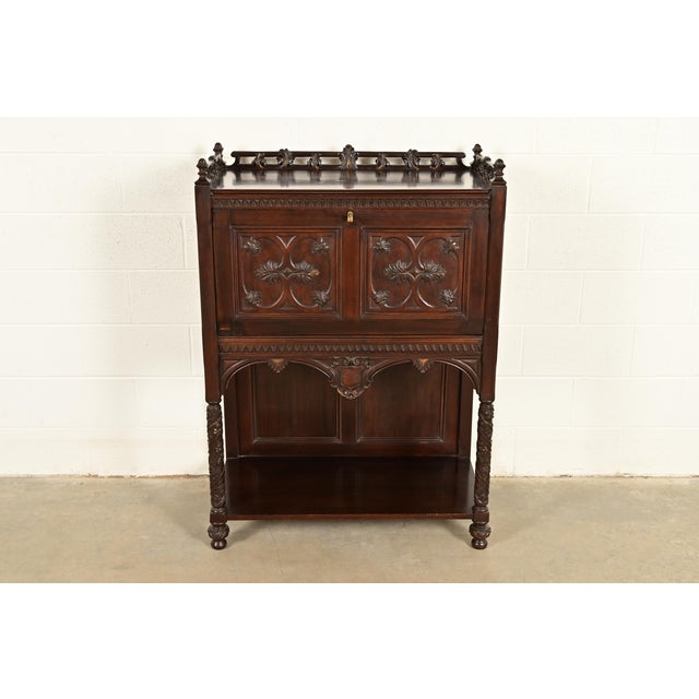 A gorgeous antique English Victorian, Gothic Revival, or Renaissance Revival drop front secretary desk In the manner of...