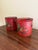 A wonderfully charming pair of early 20th century French tole cachepot finished in a rich cinnabar red with delicate...