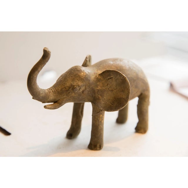 :: Vintage handmade African elephant sculpture. Circa late mid 20th century, though possibly older, this piece has such...