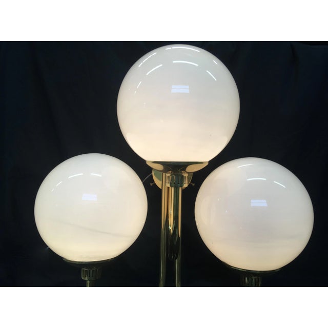 - Fantastic brass sconces in the 1980s - Globe-shaped shades in white opal Murano glass - Functional and beautiful -...