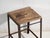 This antique industrial stool in pine wood and iron is an industrial seat with a tubular iron frame and a pine slatted...