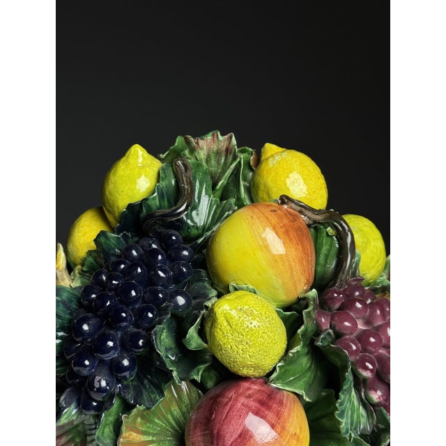 Ceramic fruit basket with apples, passion fruit, lemon, and grapes. Beautifully glazed with bright colors. In good...