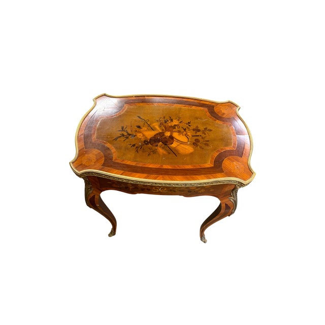This beautiful French Louis XV style side table dates to around 1870 and showcases elegant marquetry, graceful curved...