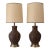 Absolutely gorgeous pair of vintage mid century ceramic lamps with relief art mimicking sgraffito woodwork. The lamps are...