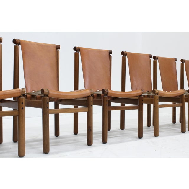 A set of 6 leather dining chairs by Ilmari Tapiovaara for La Permanente Mobili Cantù. Made in Italy in the 1950’s. These...