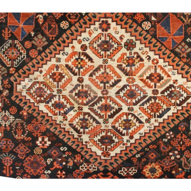 A wonderful late 19th century Gashgai rug with three large diamond medallions amidst an amazing field of flowers,...