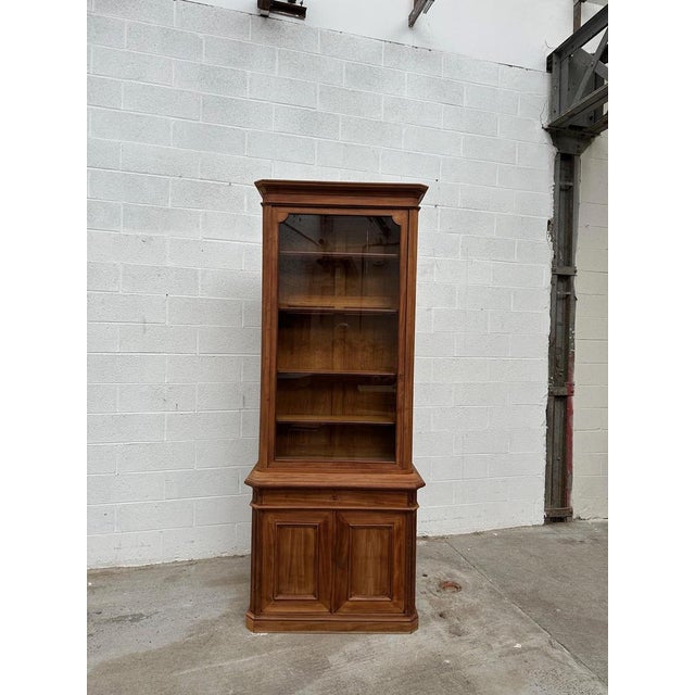 This antique mahogany display cabinet has been fully restored. The height of its glass section makes it the perfect piece...