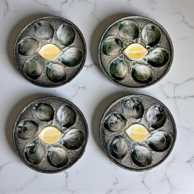 An elegant vintage set of four French oyster plates by Saint-Clément, known for its richly glazed faïence and sculptural...