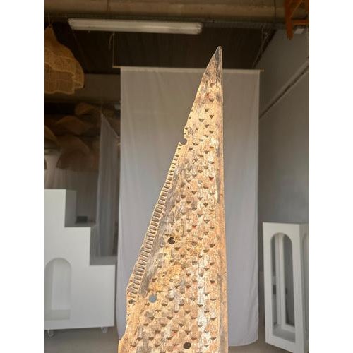 Indonesian construction element in carved wood mounted on a base. Beautiful patterns of geometric elements and friezes and...