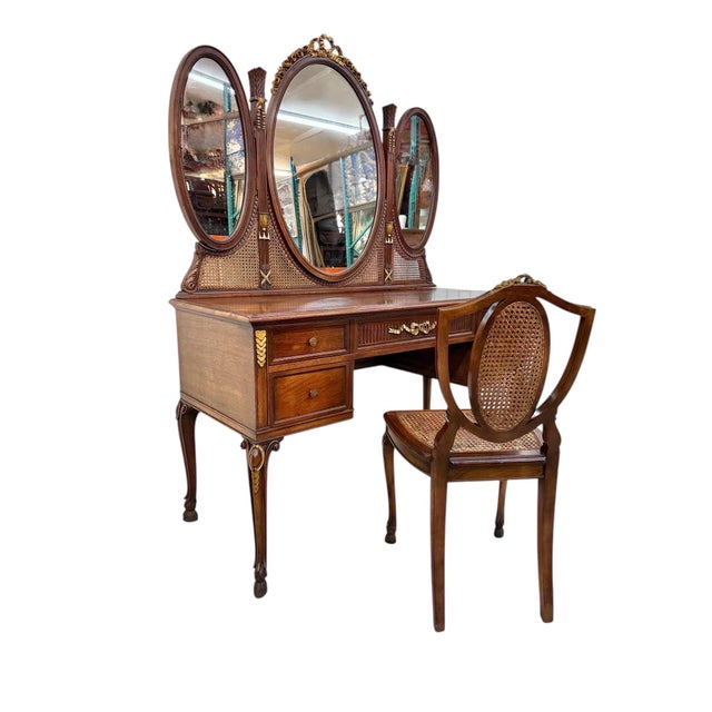 This exquisite French Louis XV style triple-oval mirror vanity is a rare example of early 20th-century American luxury...