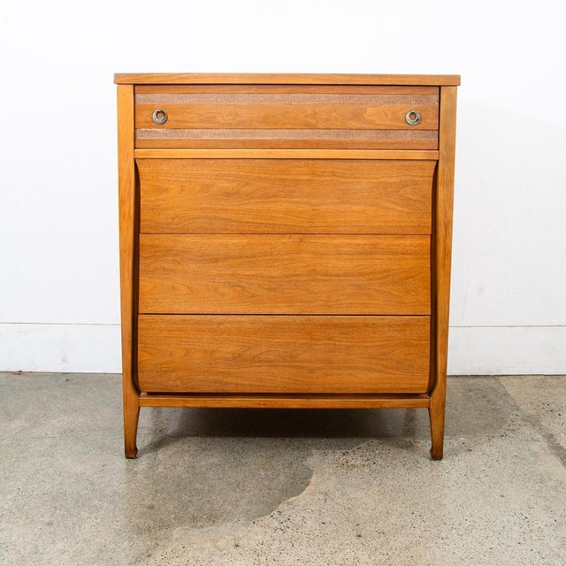 Clean 4 drawer highboy dresser by an American furniture maker during the 60s era. Tons of storage throughout the piece....