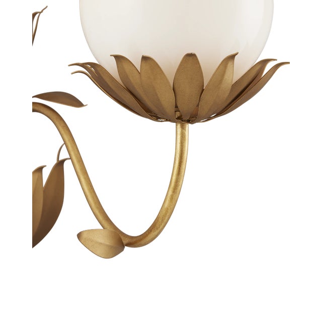 When he designed the Mirasole Gold Wall Sconce, Tom Caldwell was feeling nostalgic, remembering the décor of ice cream...