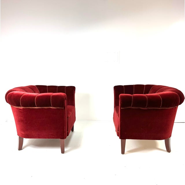 Pair of 1940's Swedish Lounge Chairs. Deep red channel back velvet upholstery. in original condition. Beech wood legs.