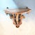Elegant vintage Florentine-style carved wood wall shelf featuring an architectural demilune top supported by elaborate...