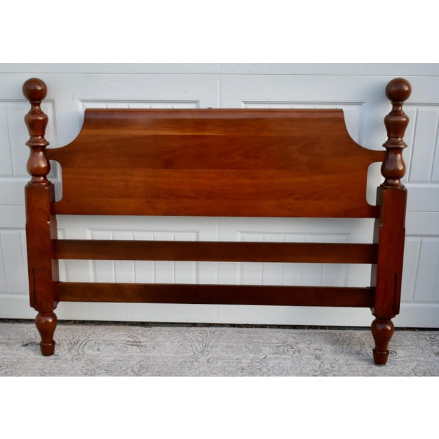 Vintage ( 1970's) Headboard has an Americana Style. Made of Wood. Cherry Wood. Cannon Ball Details. The Measurements: 57"L...