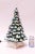 Circa 1970 illuminated ceramic Christmas tree coated in a dusting of snow and adorned with a clear star. Features a built-...