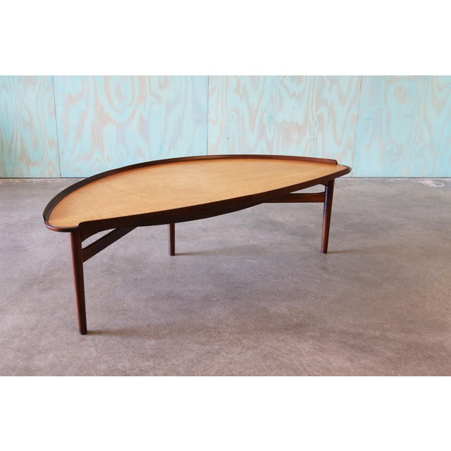A 1950s coffee or cocktail table Attributed to Finn Juhl and produced by Baker in 1951. Larger scale table with...
