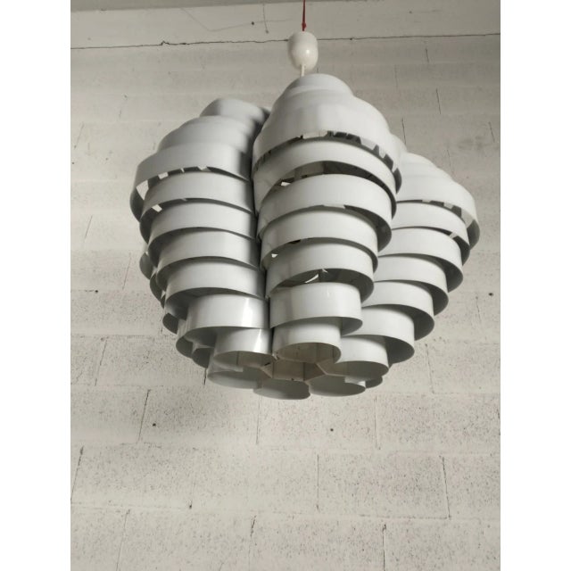 Metal bands that intertwine to form a floating geometric shape. Elio Martinelli was born on November 19, 1922. After a...