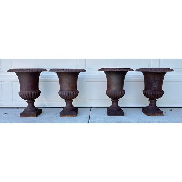 Set of 4 Antique French Cast Iron Garden Urns, Circa 1920 Dimensions: 24.5” H × 19” W × 19” D Material: Cast Iron Origin:...