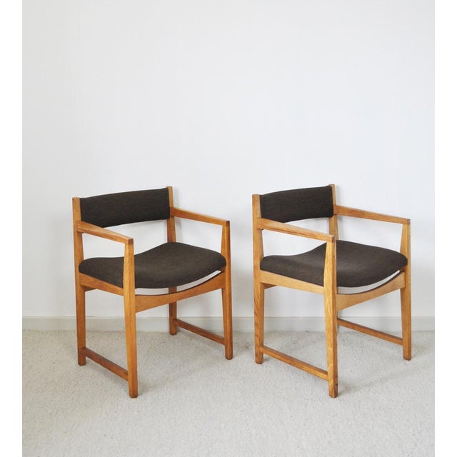 Two armchairs model 350 designed by peter hvidt & orla mølgaard-nielsen made of solid oak. Upholstered with dark brown...