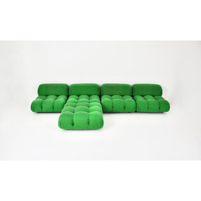 Modular sofa in green fabric. It consists of 5 pieces. Seat height: 35 cm. Dimensions of one piece: h: 65 cm w: 93 cm d:...