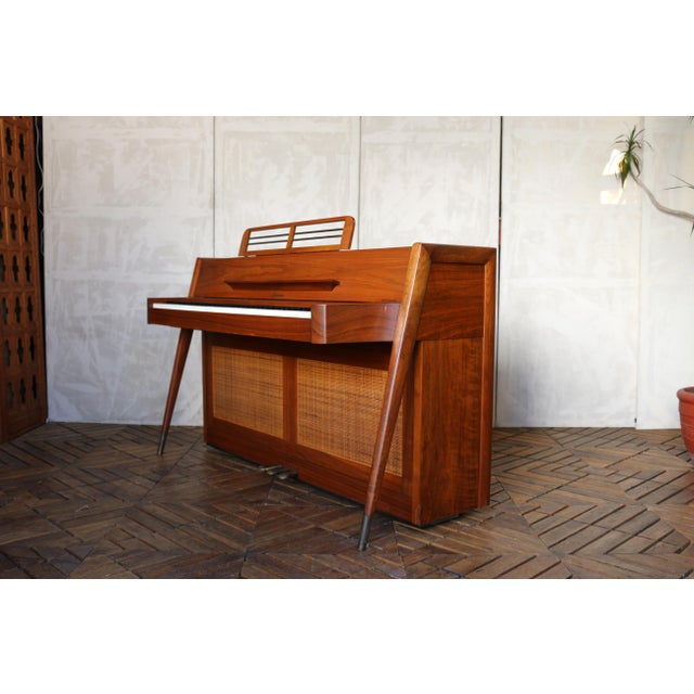 A beautifully designed Baldwin Acrosonic upright piano showcasing the clean lines and organic warmth of Mid-Century Modern...