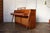 A beautifully designed Baldwin Acrosonic upright piano showcasing the clean lines and organic warmth of Mid-Century Modern...