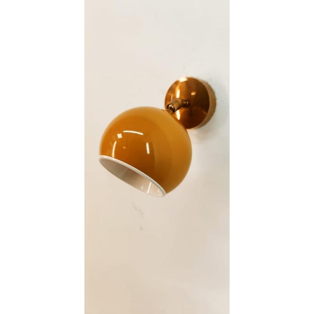 Adjustable Wall Light with Yellow Metal Dome, in Very Good conditions. Designed 1970 to 1979 Up to 250V (Europe/UK...