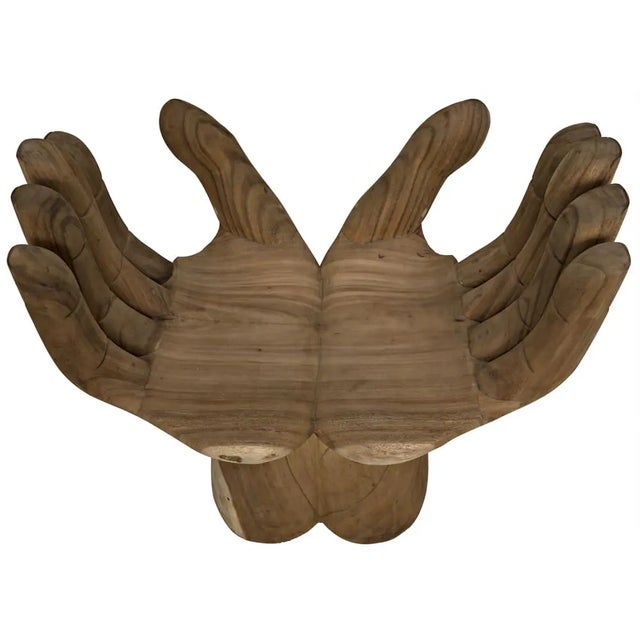 Intriguing and ethereal, bold yet whimsical, this dramatic chair cradles you in two hand-carved teak hands. Each piece is...