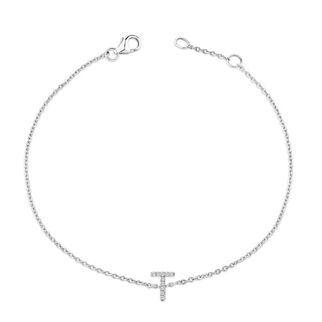 Immerse yourself in the understated elegance of this 10K white gold bracelet, rhodium-plated for an enrapturing shimmer...