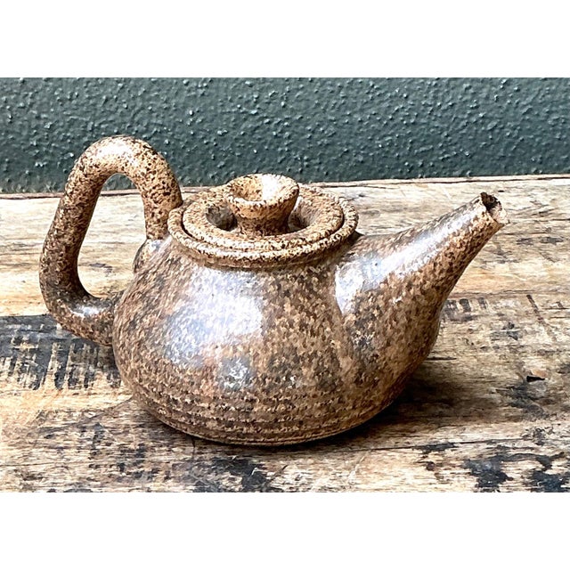 Beautifully handcrafted in the spirit of mid-century studio pottery, this vintage stoneware teapot embodies the timeless...