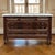 French Mahogany Louis XVI Style Commode with Carrara Marble Top is elegant in line and exceptional in finish and...