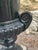 Monumental neoclassical cast iron urn with an unusual smooth rim and scrolled volute handles most likely made by Campania...