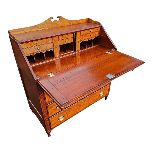 This Early 19th-century Federal Slant-front Desk is a monument to the elegance and craftsmanship of America's Federal...
