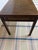 Vintage Chinoiserie-style burl wood writing desk, originally manufactured by Baker Furniture Company, featuring a...
