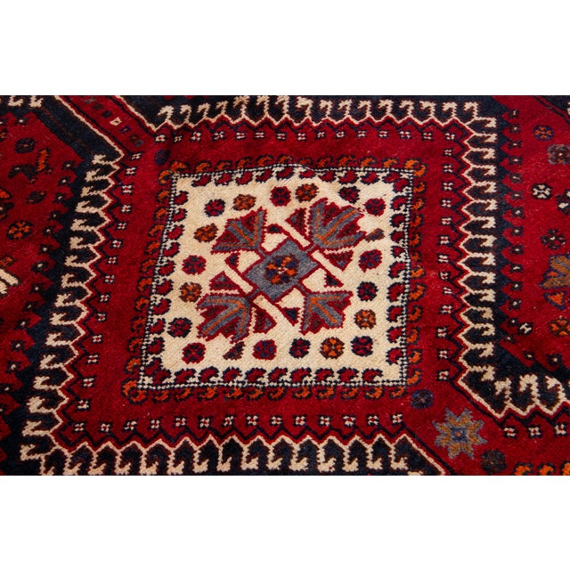 Beige Vintage Persian Hand-Knotted Wool Rug Featuring a Red Field and a Tribal Design For Sale - Image 8 of 10