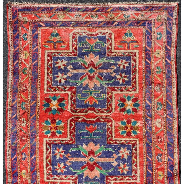 Measures: 4'8 x 8'2 Vintage Caucasian Kazak Rug with Cross Medallions in Red and Blue 4'8 x 8'2. Keivan Woven Arts/...