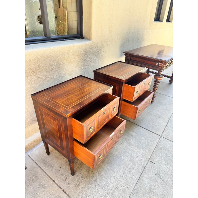 Beautiful rare pair of original Ebanista wood in-lay nightstands or side tables. Acquired from a storied Hollywood Hills...